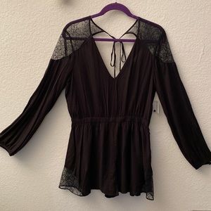 Never worn Black Lacey romper with long sleeves. Size ten. Kimchi Blue.
